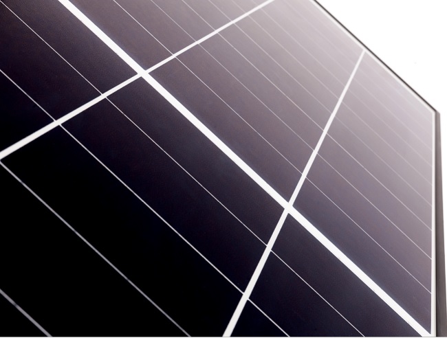 Close up of solar panel surface with sunlight reflection